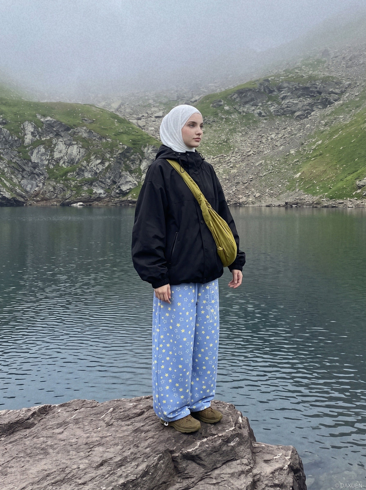 Side view of wide-leg trousers with drawstring waist and star print