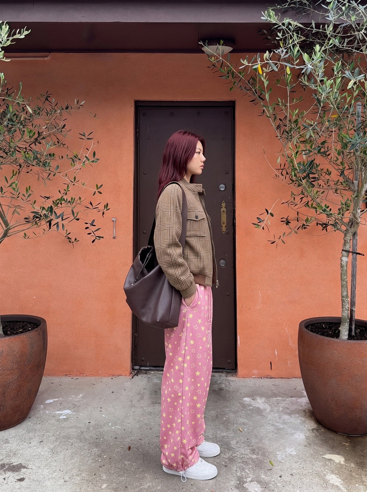 Wide-leg star print trousers shown in a relaxed full-length view