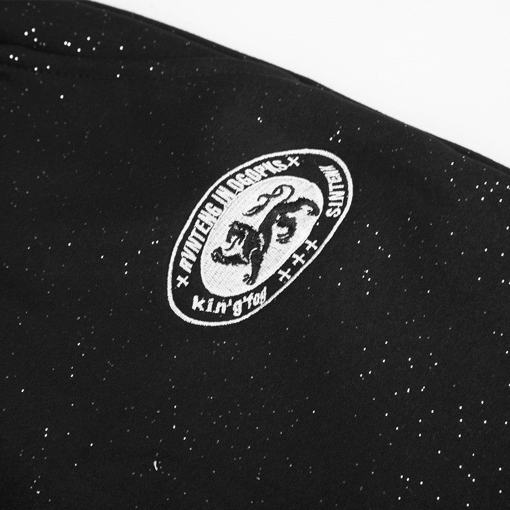 Waistband detail of embroidered fleece sweatpants
