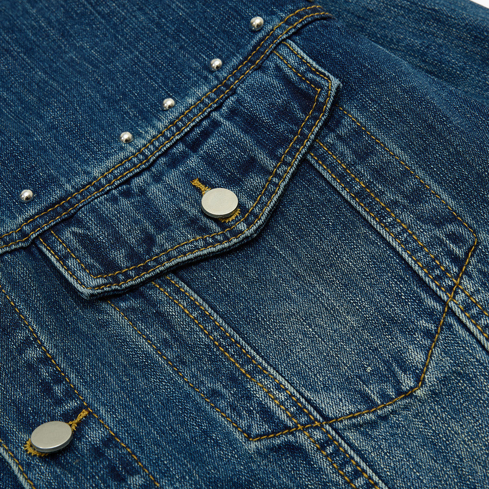 Back view of a studded black denim jacket