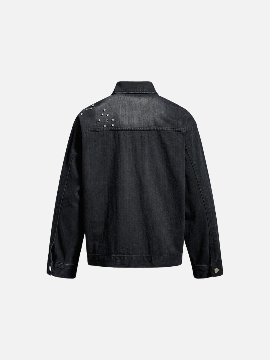 Back view of a studded blue denim jacket