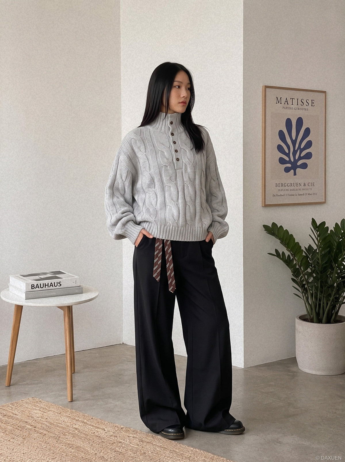 Textured cable knit jumper displayed on a model