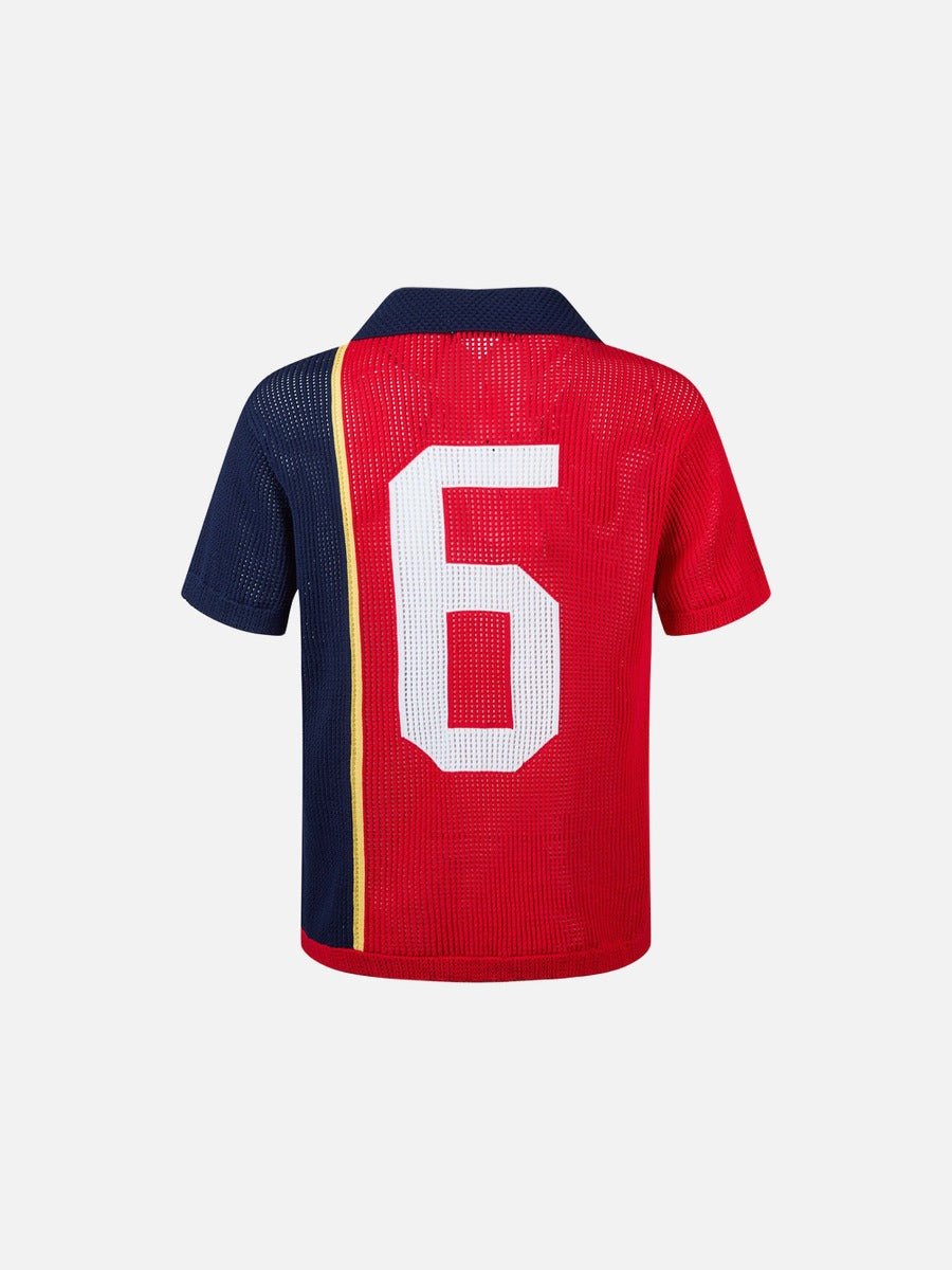 Detail of number graphic on the front of the polo shirt