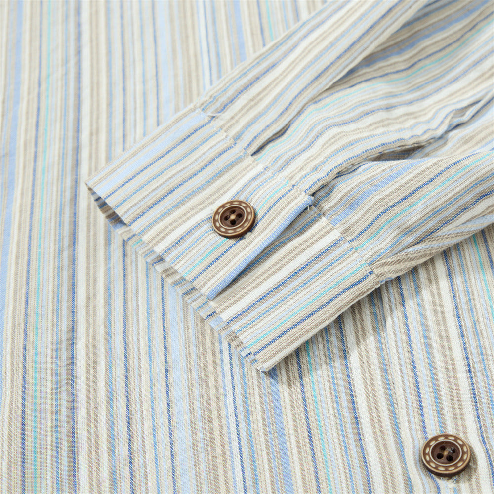 Close-up of the button placket on the vertically striped shirt