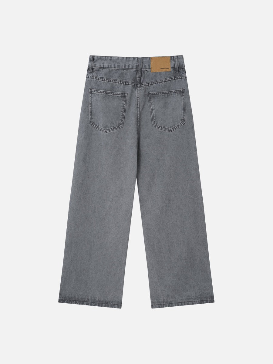 Waistband detail of grey wide-leg jeans with front fastening