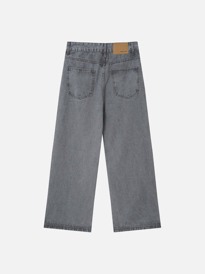 Waistband detail of grey wide-leg jeans with front fastening