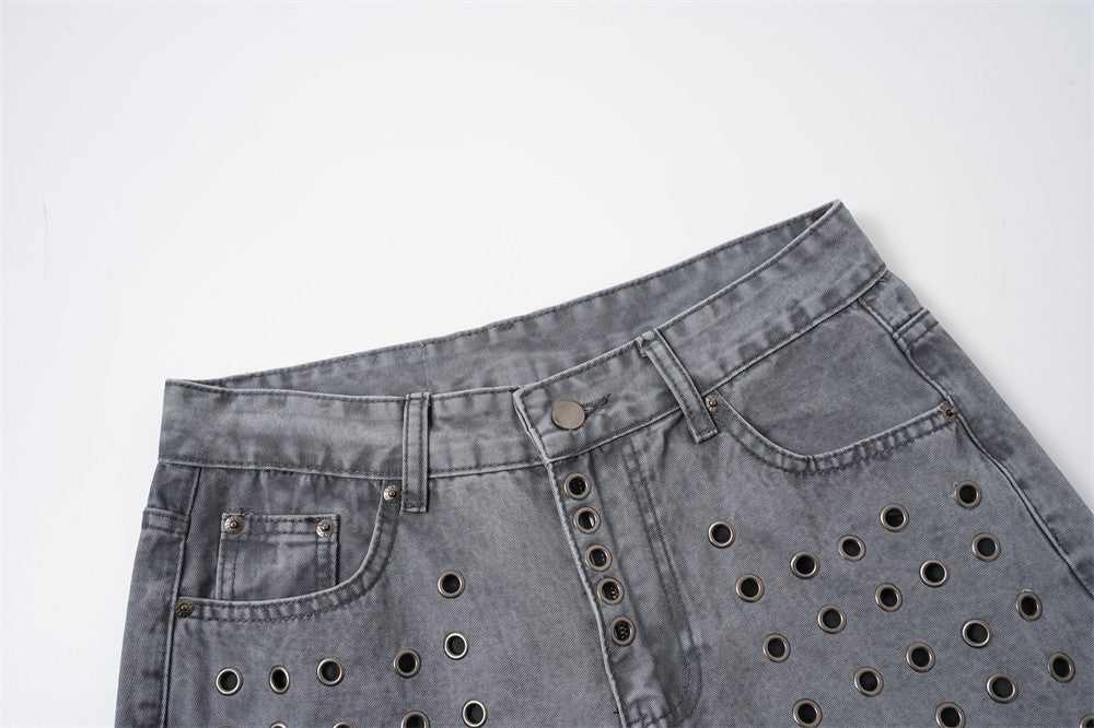 Lower leg and hem detail of grey wide-leg jeans