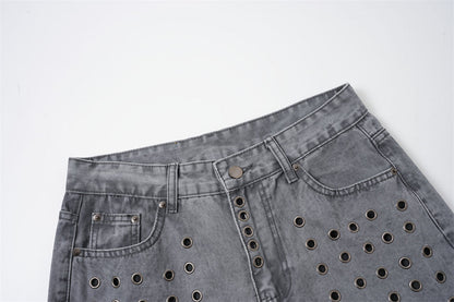 Lower leg and hem detail of grey wide-leg jeans