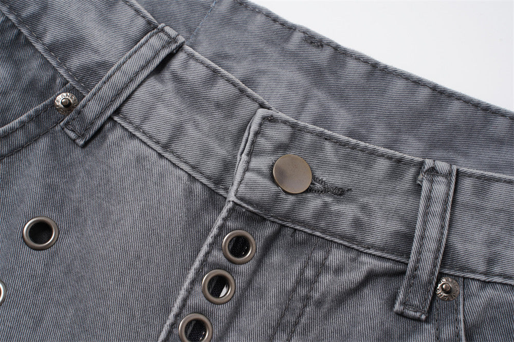 Angled view of grey wide-leg jeans with metal eyelet detailing