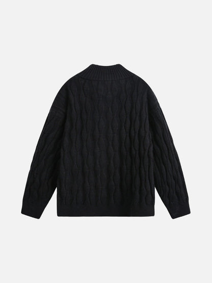 Close-up of the jumper’s cable knit sleeve texture