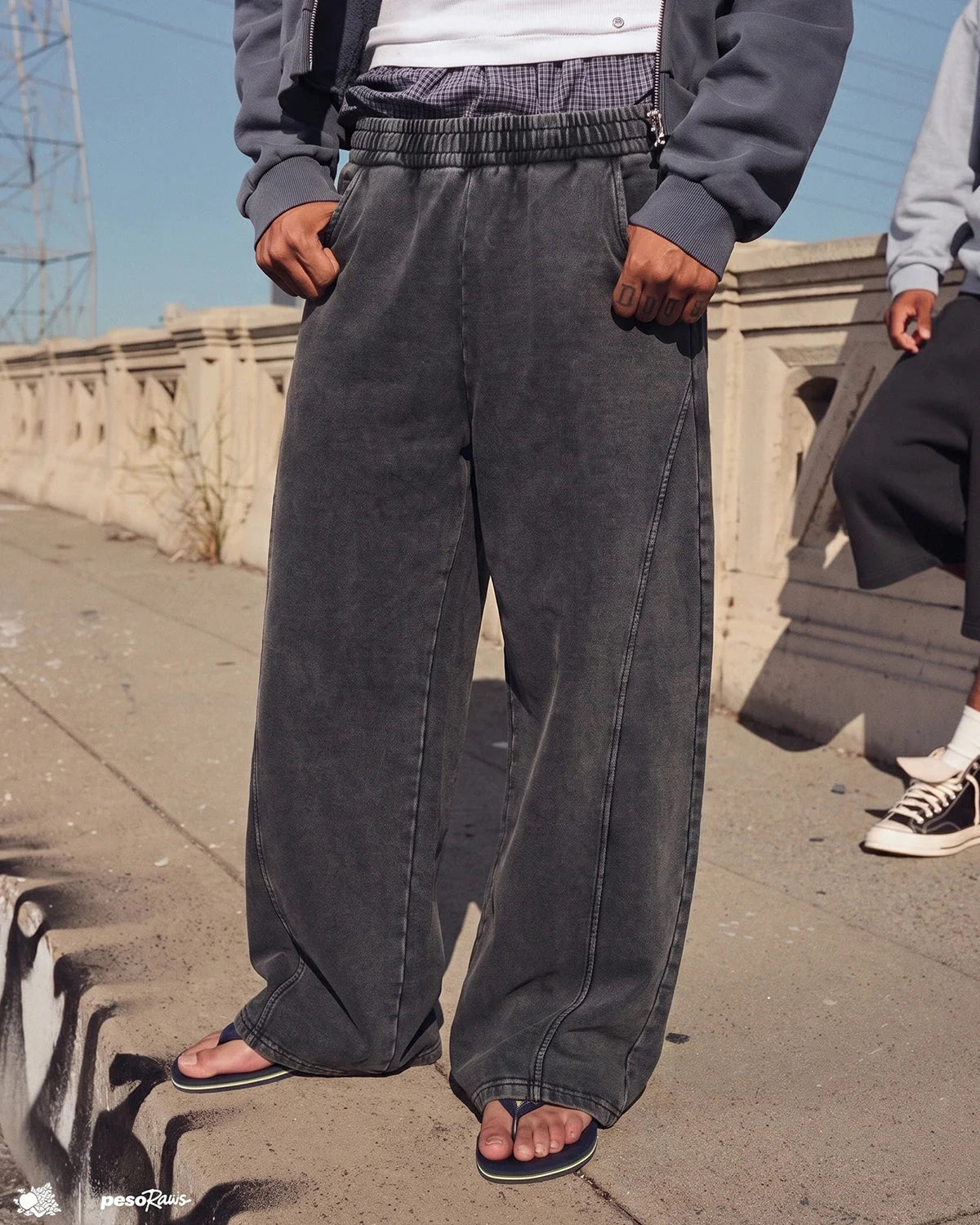 Lower-leg detail of the barrel-fit sweatpants
