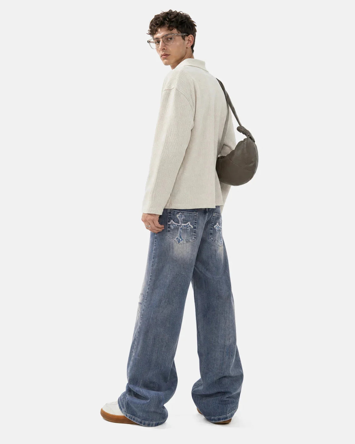 Full-length view of embroidered bootcut jeans