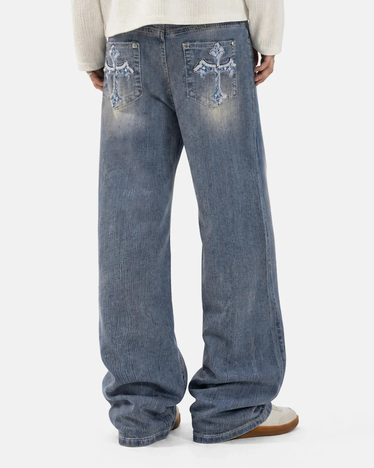 Side view of embroidered bootcut jeans with a flared hem