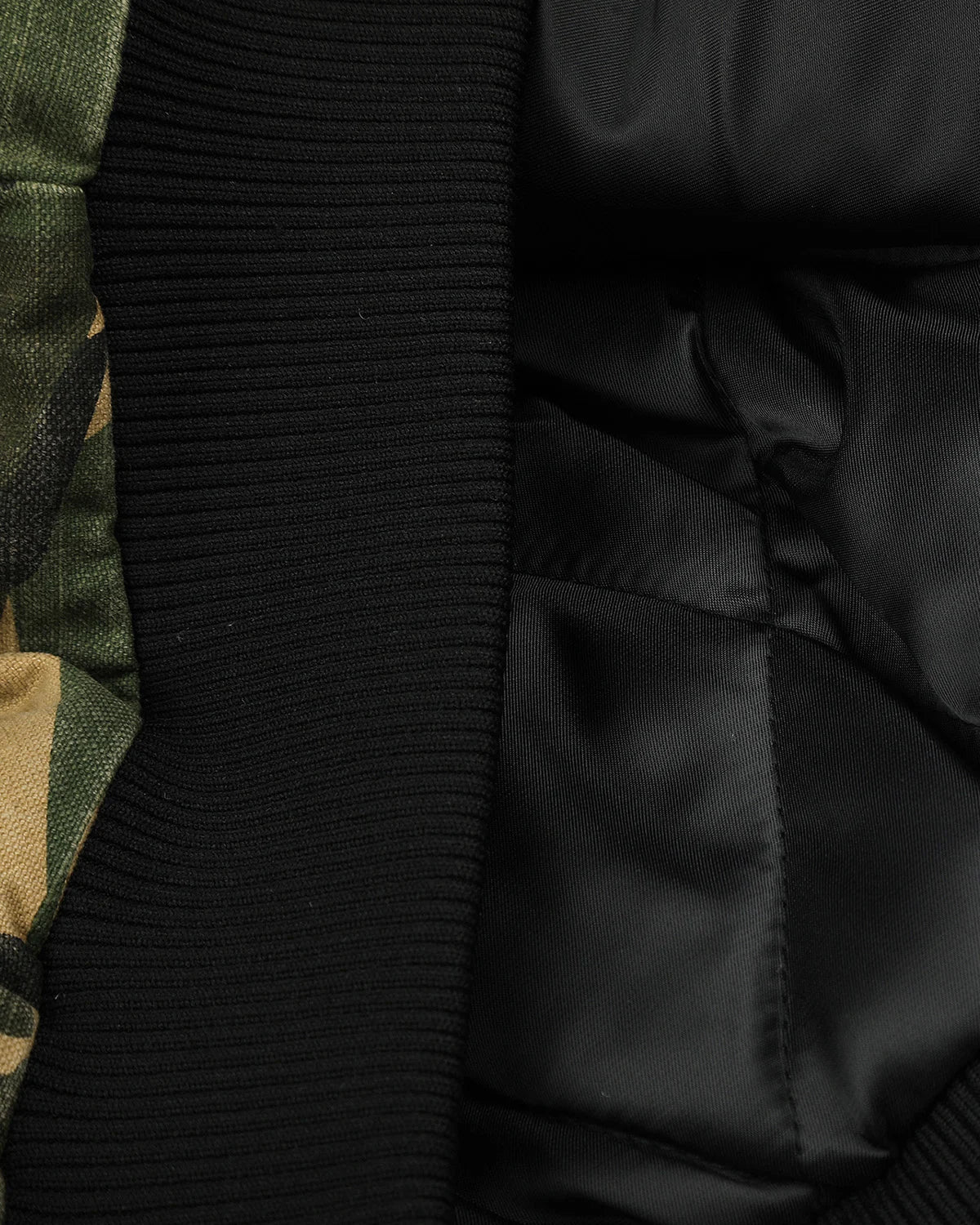Camo hooded bomber jacket styled as streetwear outerwear