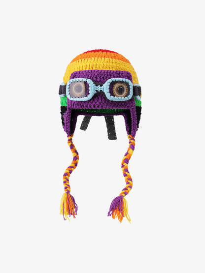 Crochet trapper hat showing its ear flaps and goggles embellishment