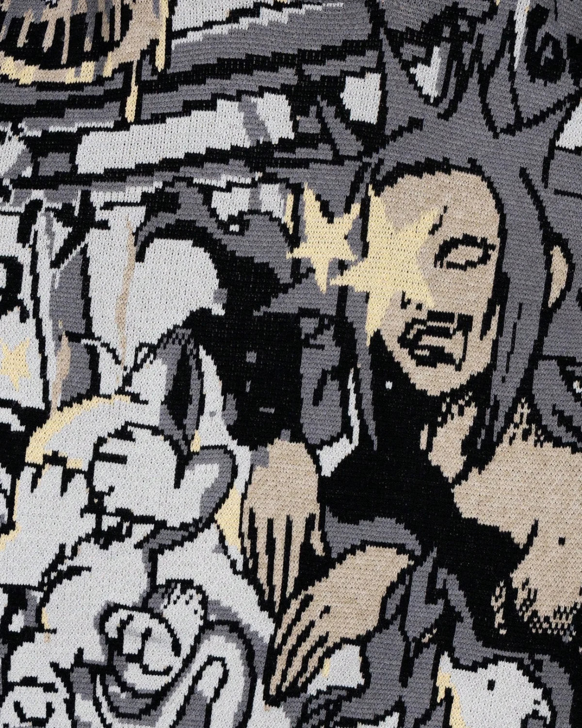 Cuffed sleeve detail on the comic graphic knitted jumper