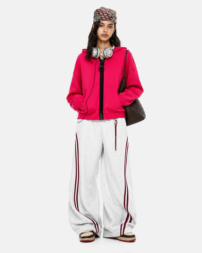 Three-quarter view of the contrast zip-up hoodie