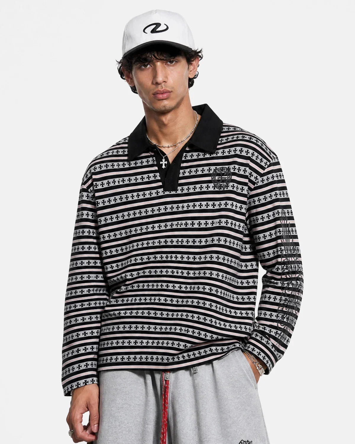 Cross graphic striped polo shirt styled for casual wear