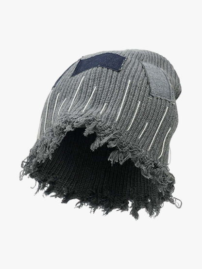 Patchwork denim beanie showing its textured panels