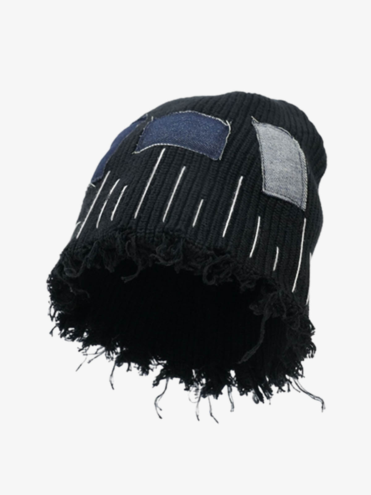 Close-up of the frayed edge on a denim patchwork beanie