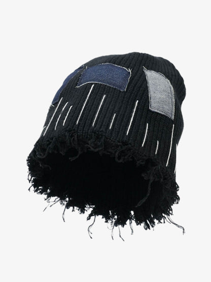 Close-up of the frayed edge on a denim patchwork beanie