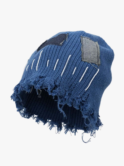 Distressed denim patchwork beanie with a frayed edge