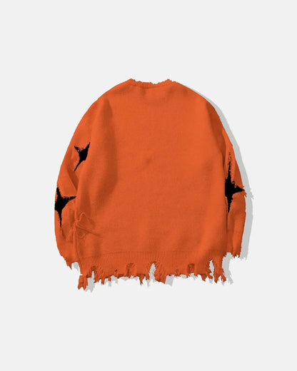 Distressed skull sweater displayed to show its relaxed knit shape