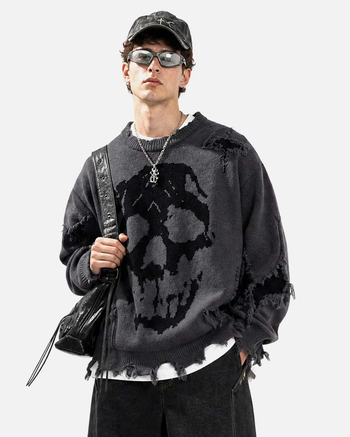 Distressed knit texture and skull design on the sweater