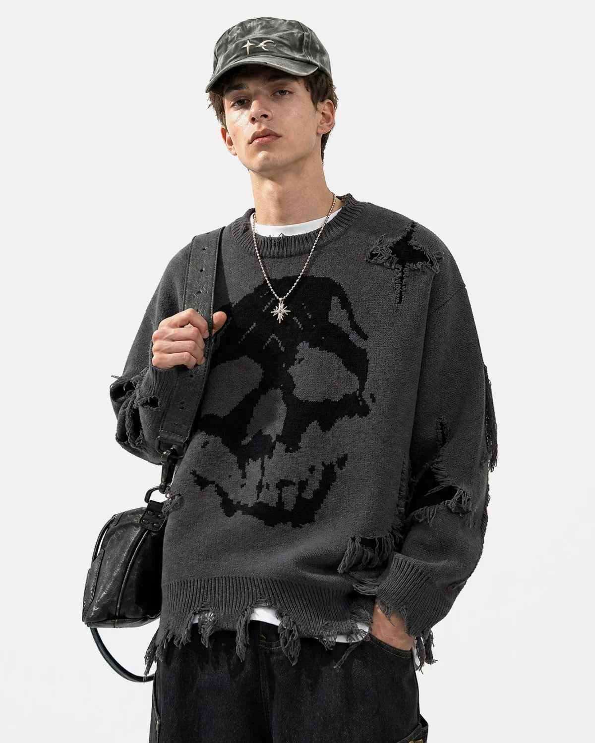 Close-up of the skull motif on the knitted sweater