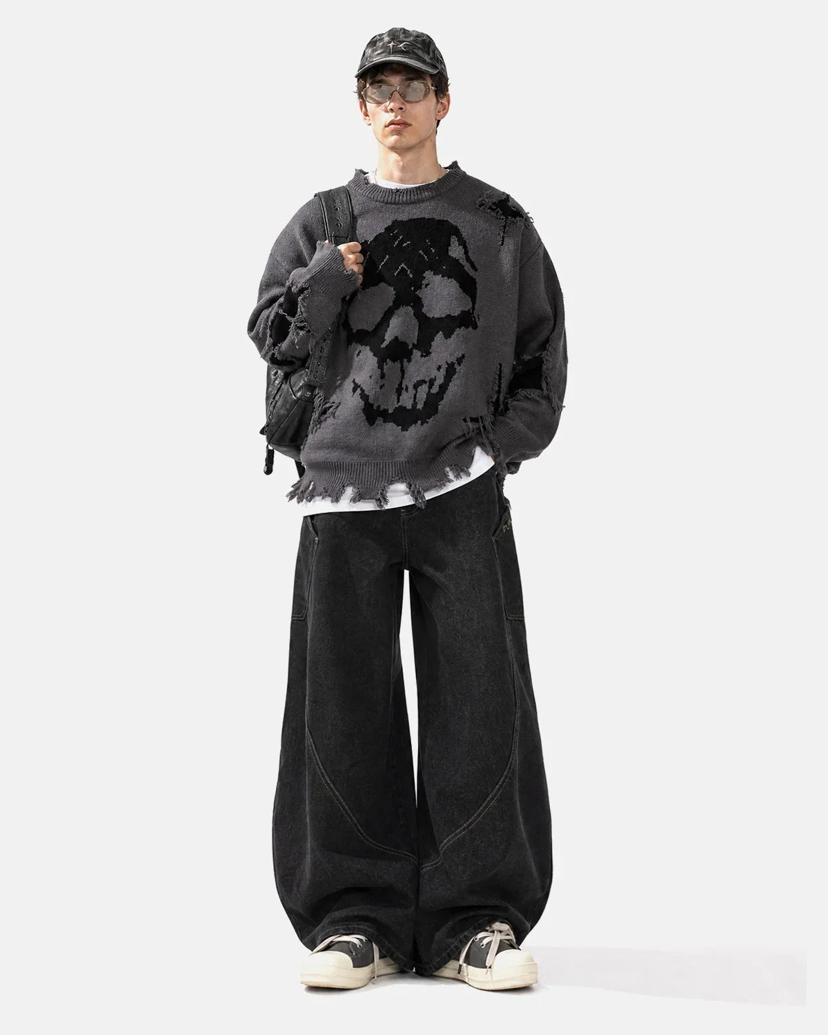 Side view of the distressed skull knit sweater