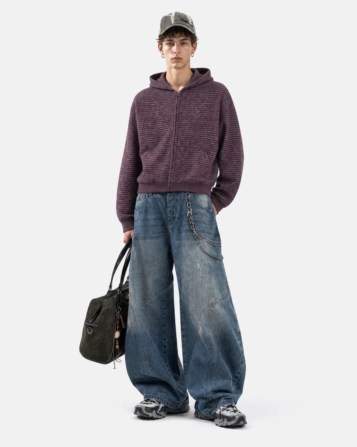 Back view of the fuzzy hoodie with horizontal stripes and a relaxed fit