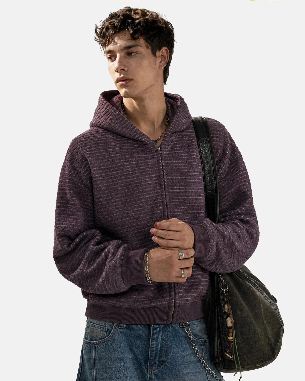 Side view of the striped zip-up hoodie showing its boxy silhouette