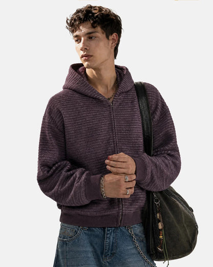 Side view of the striped zip-up hoodie showing its boxy silhouette