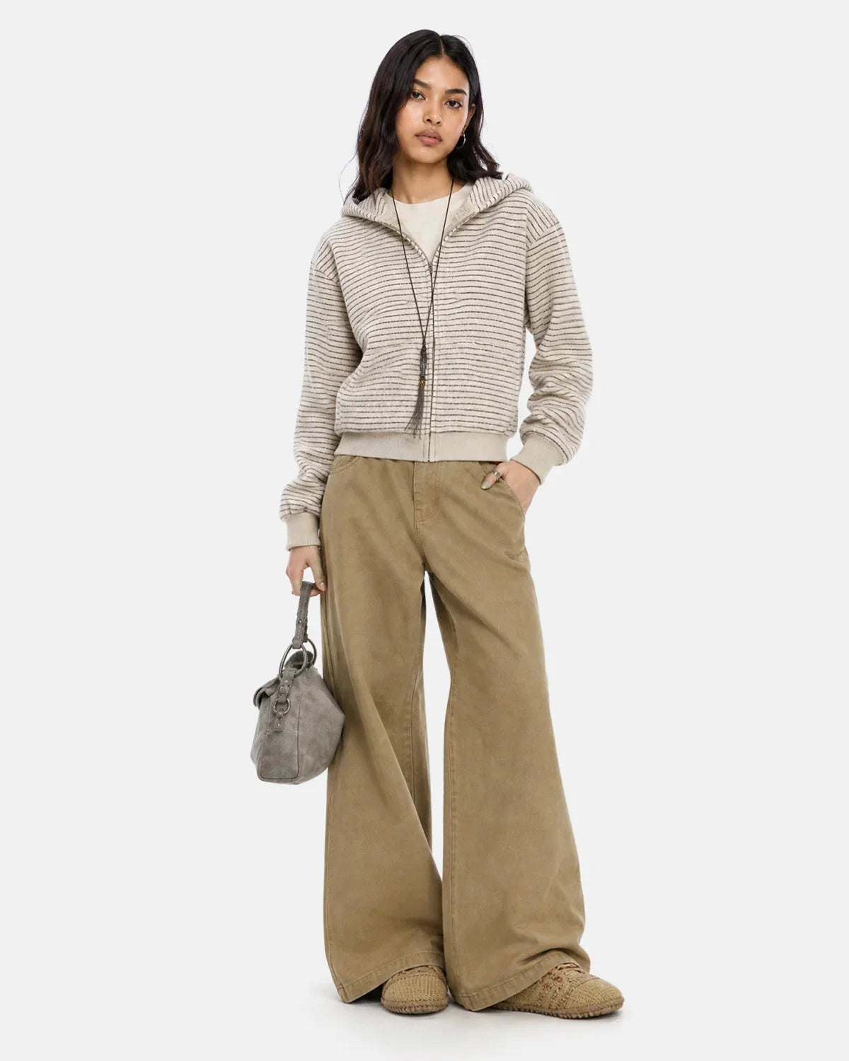 Fuzzy striped zip-up hoodie displayed as an easy layering piece