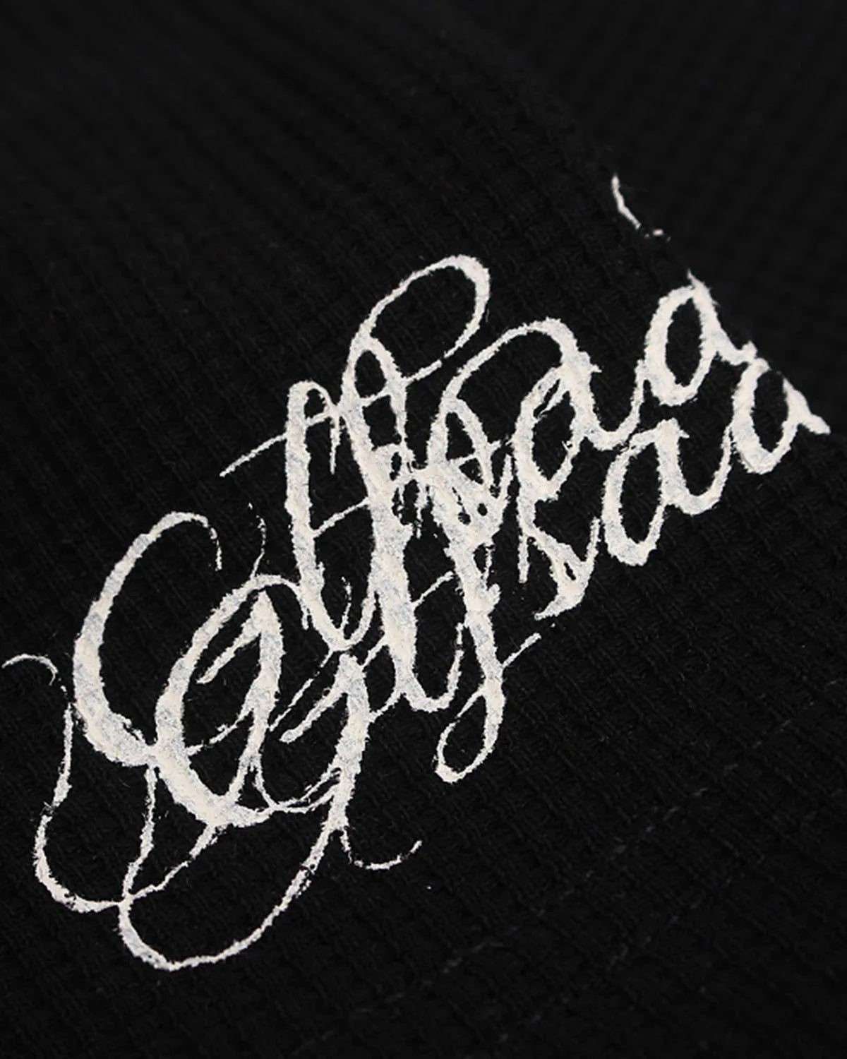 Detailed view of the neckline and graphic front on the waffle T-shirt