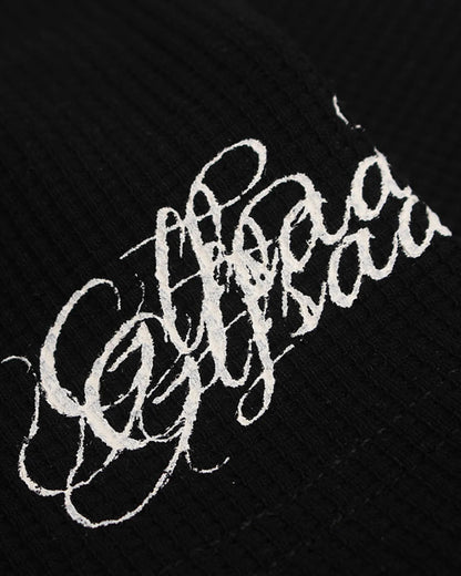Detailed view of the neckline and graphic front on the waffle T-shirt