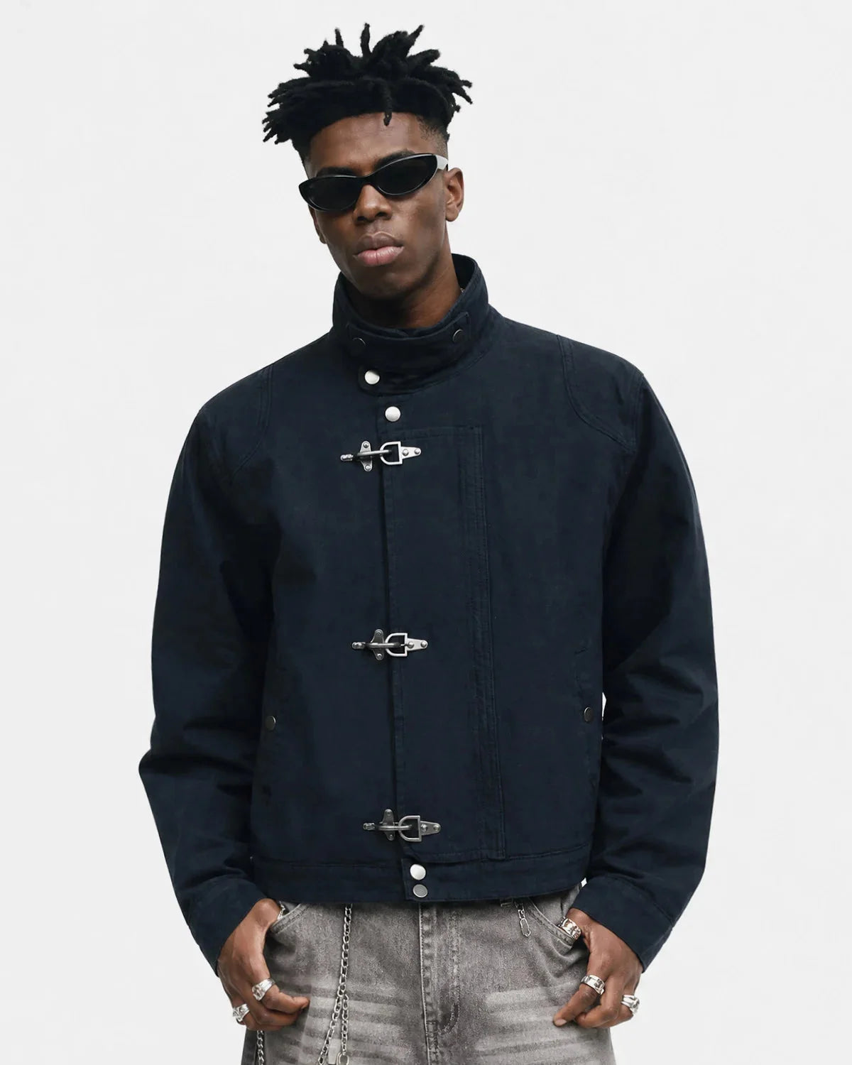 Boxy workwear jacket with metal clasp shown from the front