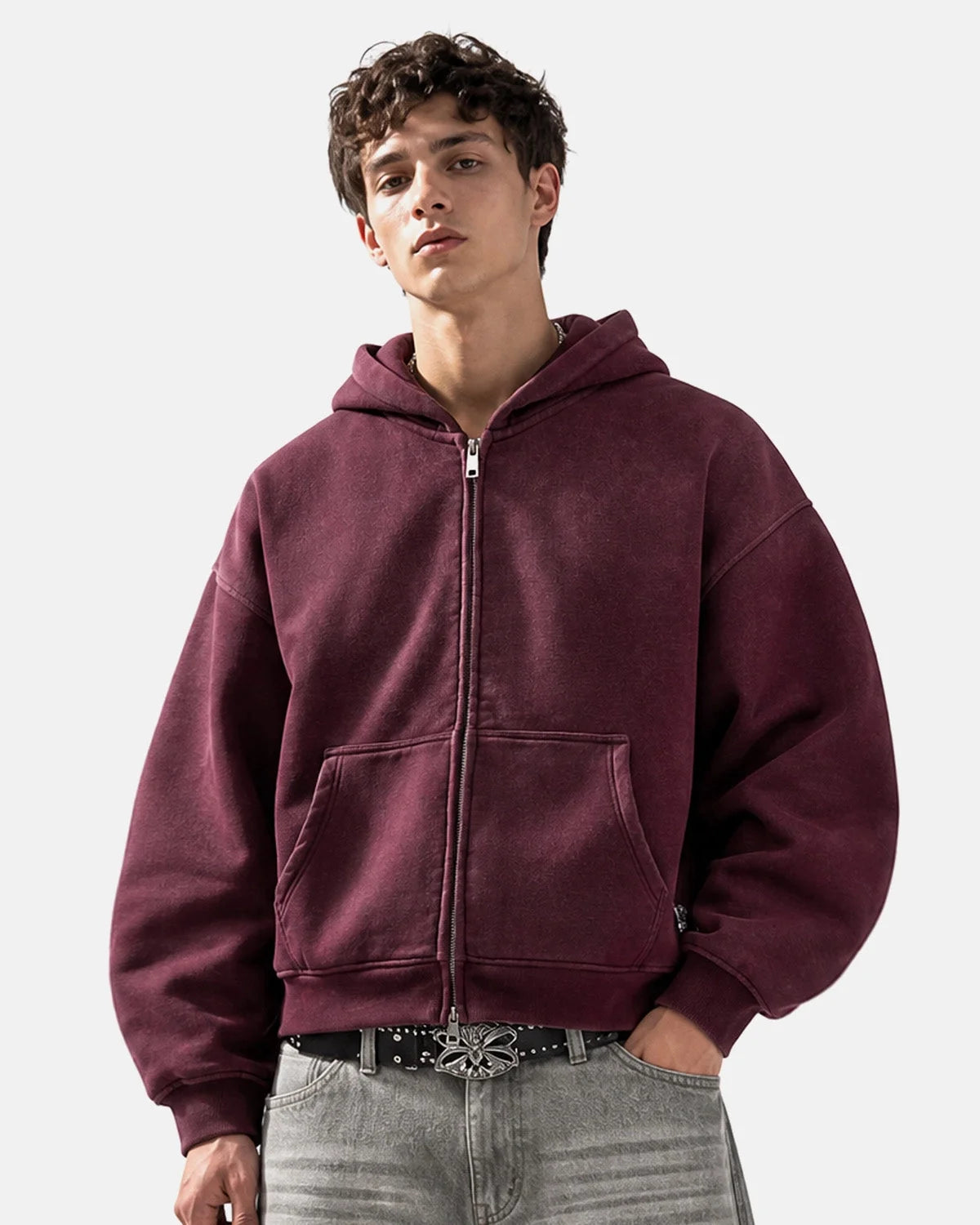 Detail of the zip fastening and front pockets on the monkey hoodie