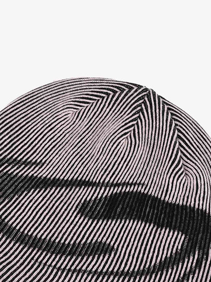 Full view of the striped graphic beanie with spike detail