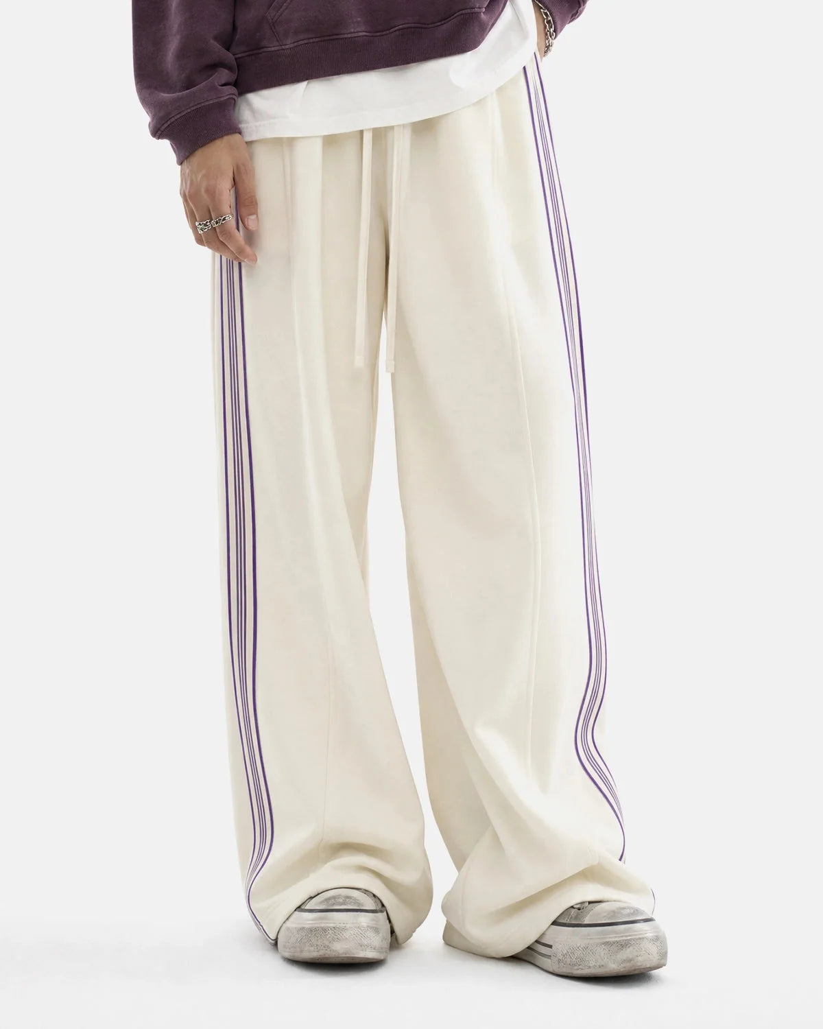 Detail of the waistband and side stripe on track trousers