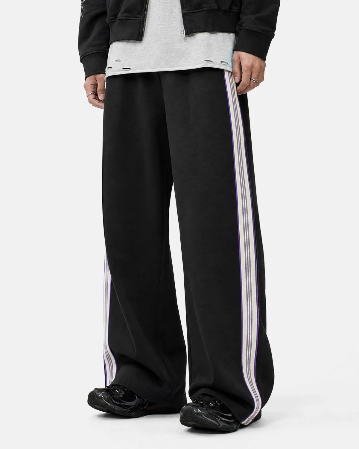 Close-up of the side stripe detail on track trousers