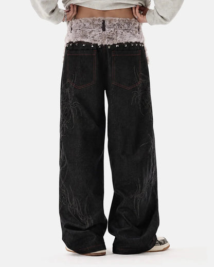 Full view of studded baggy jeans with a relaxed leg shape