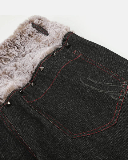 Back view of studded faux fur waistband baggy jeans