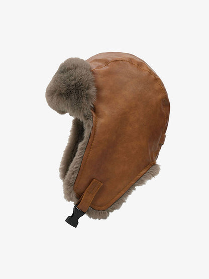 Close-up of the distressed leather texture on the trapper hat