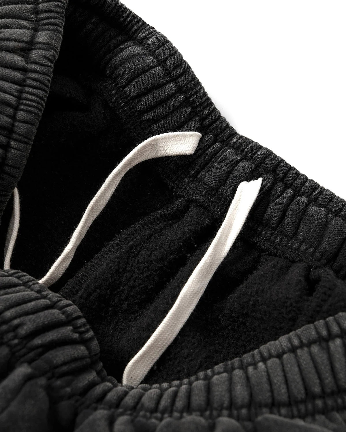Detail of the waistband and drawstring on the sweatpants